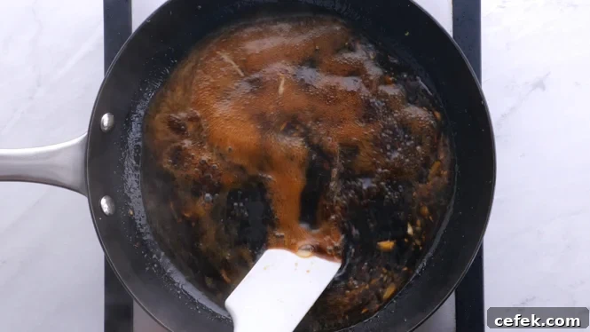 simmering sauce in large skillet