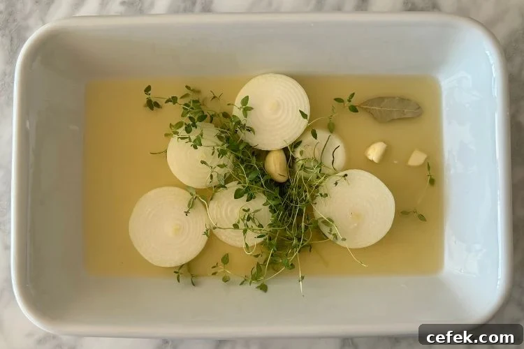 Roasting pan with onions and broth