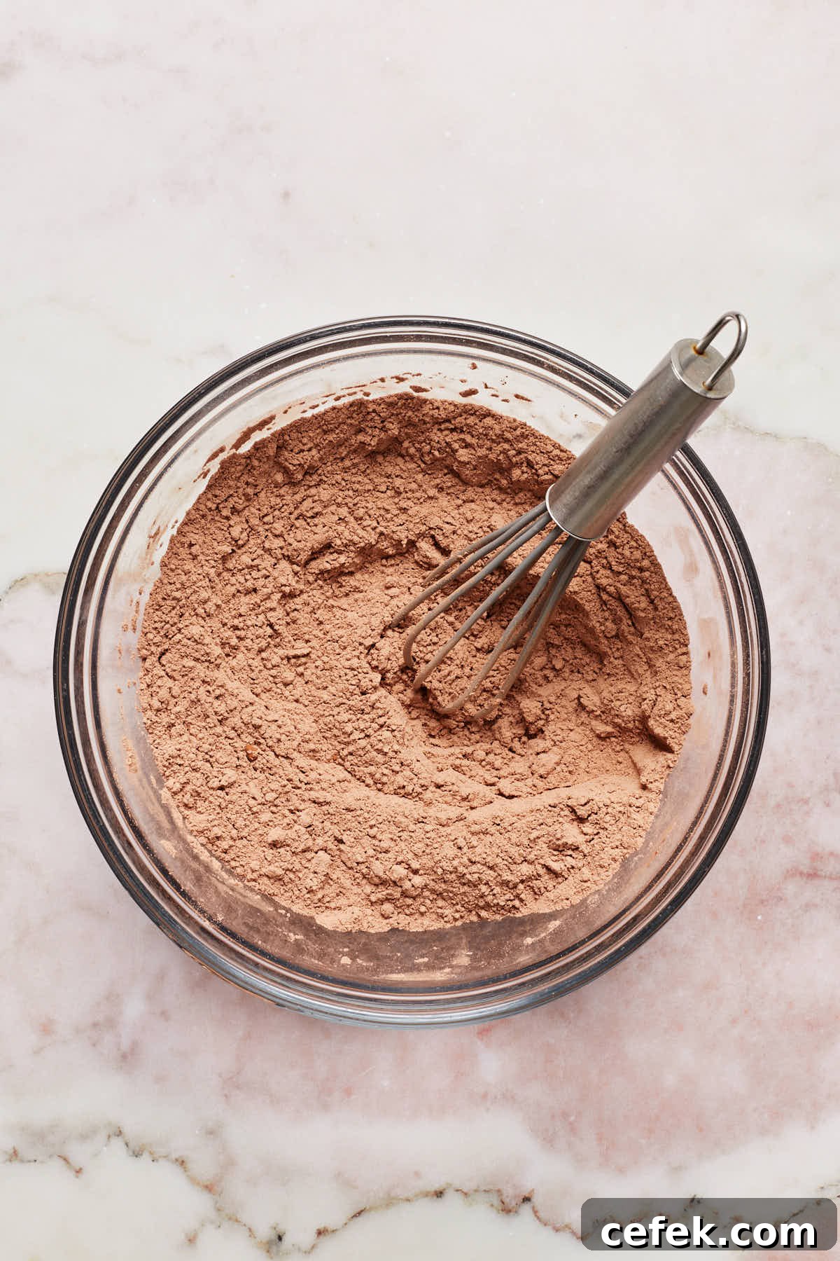 Dry ingredients whisked together in a bowl.