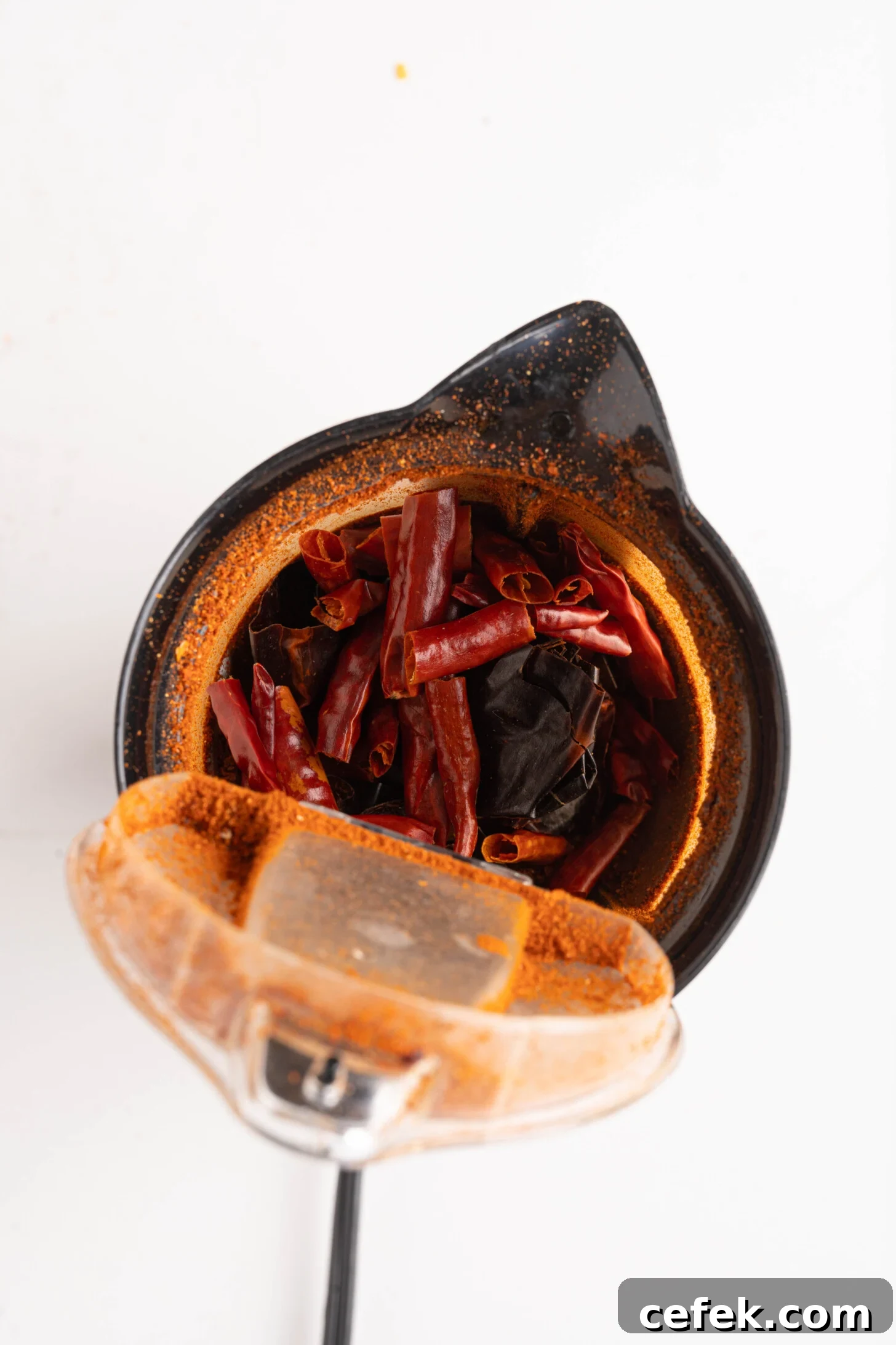 dried peppers in a spice grinder