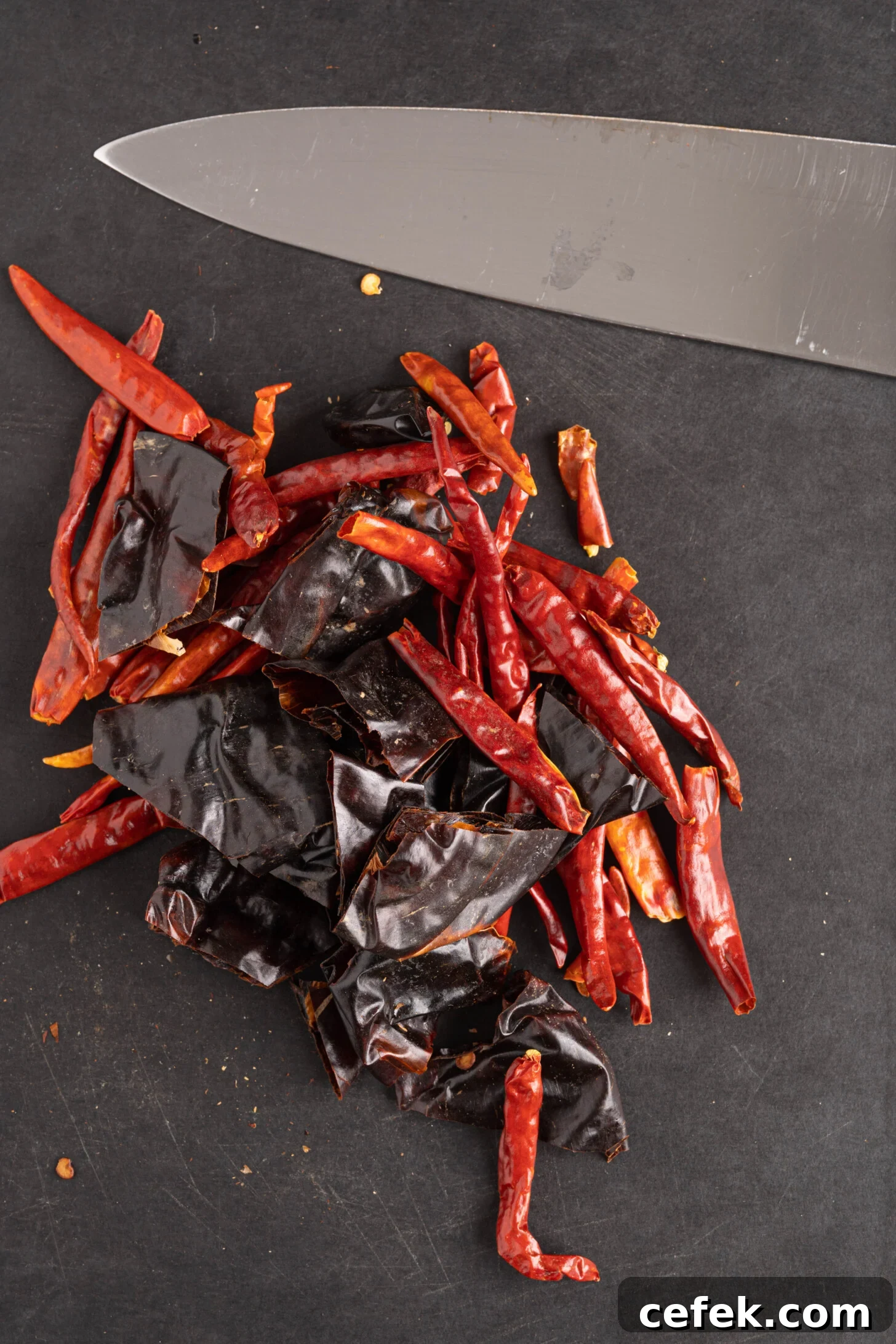 chopped dried peppers on a cutting board