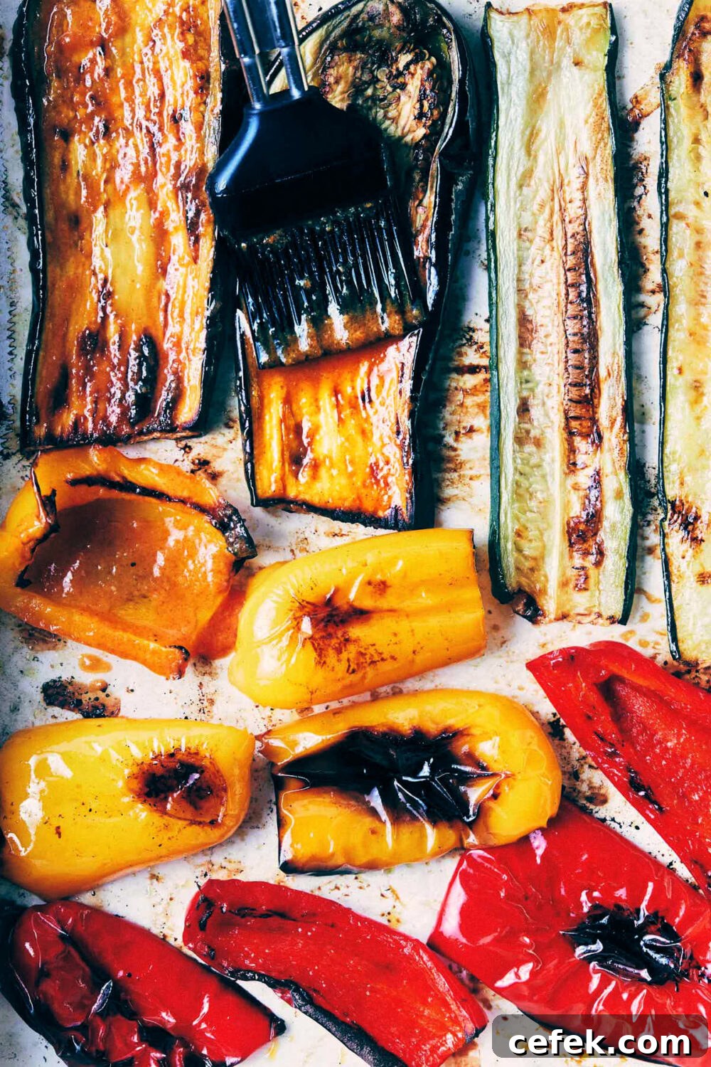Veggies being brushed with peri-peri suace before being roasted