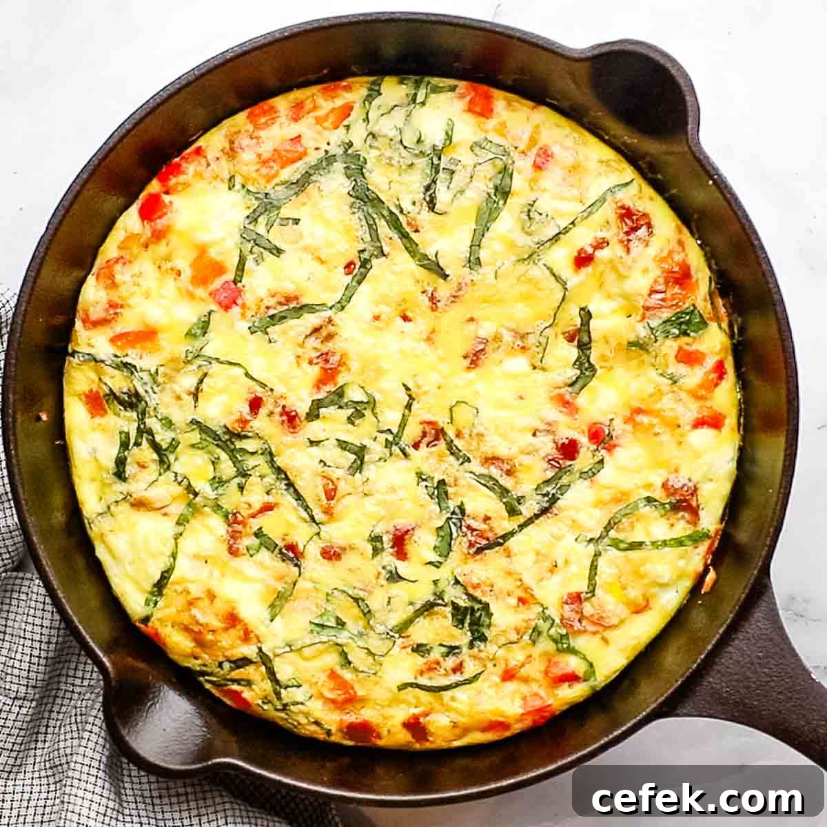 baked goat cheese frittata in a cast iron skillet