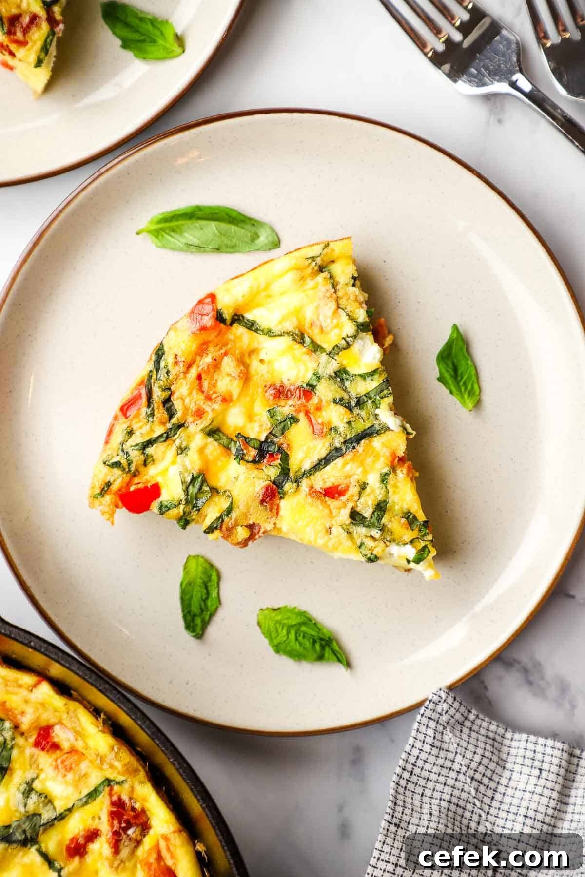 overhead view of a slice of goat cheese frittata