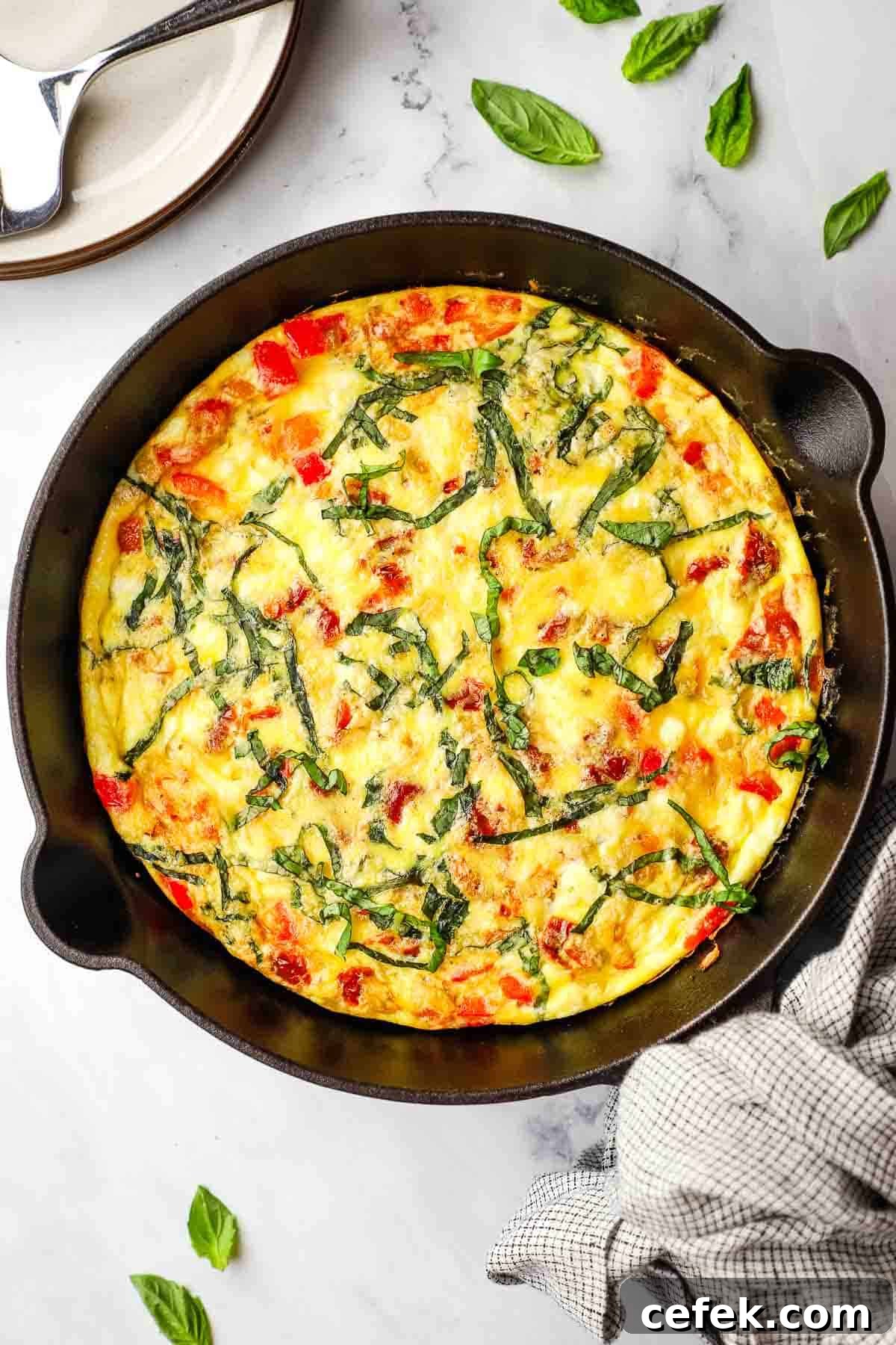 overhead view of a skillet of baked goat cheese frittata