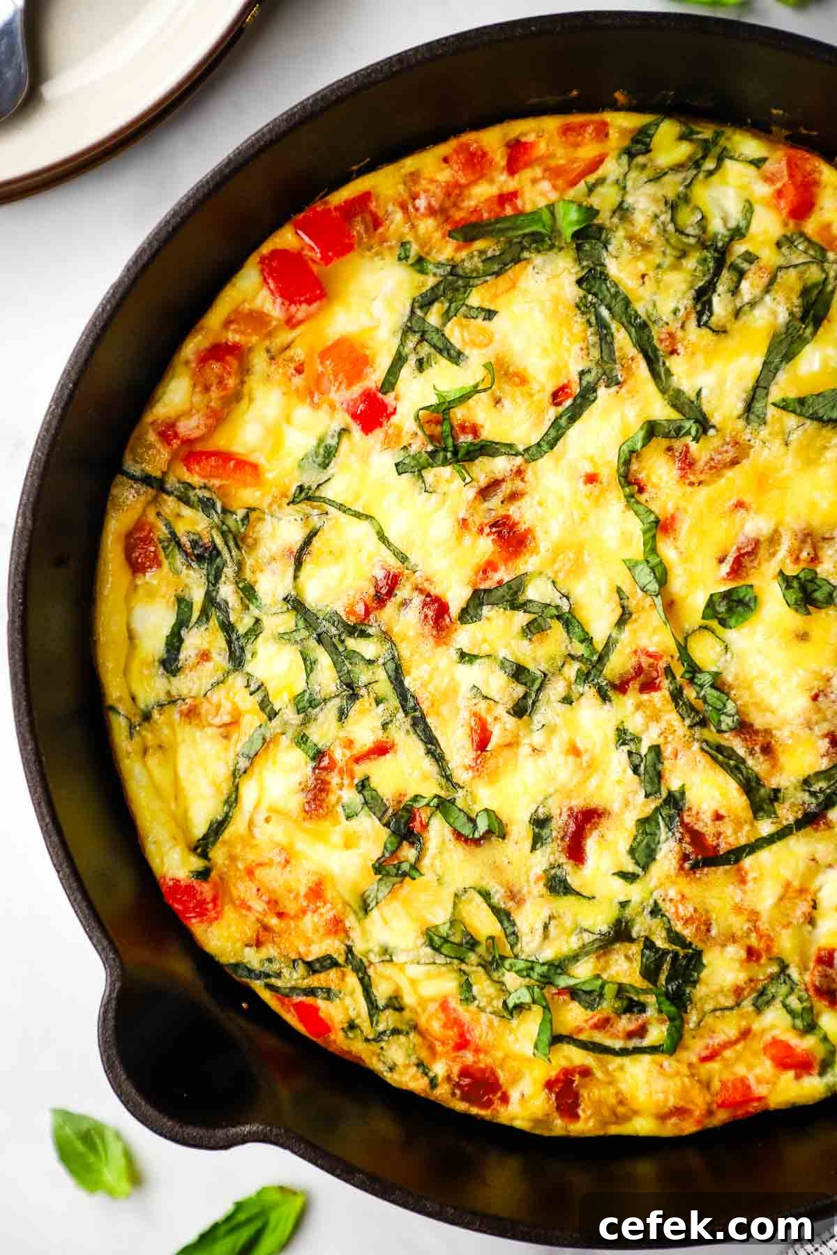 overhead view of a baked skillet of goat cheese frittata