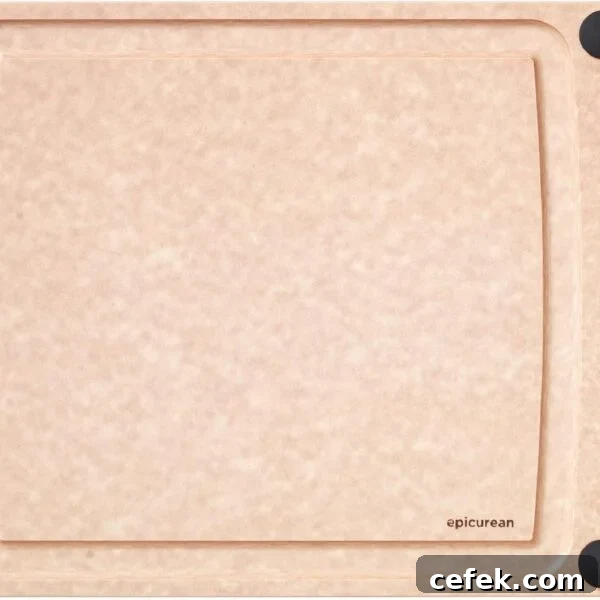 A rectangular, light brown cutting board with a smooth surface, four black non-slip corners, and a small hole on the left side. The brand name epicurean is printed in the lower right corner.