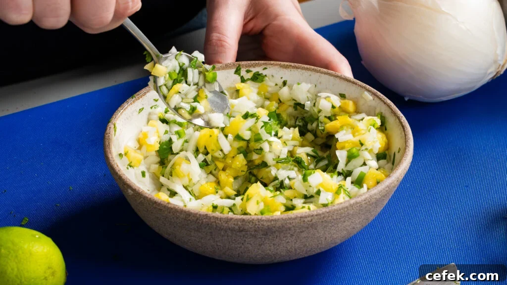 Making a delicious pineapple salsa for a chipotle chicken recipe.