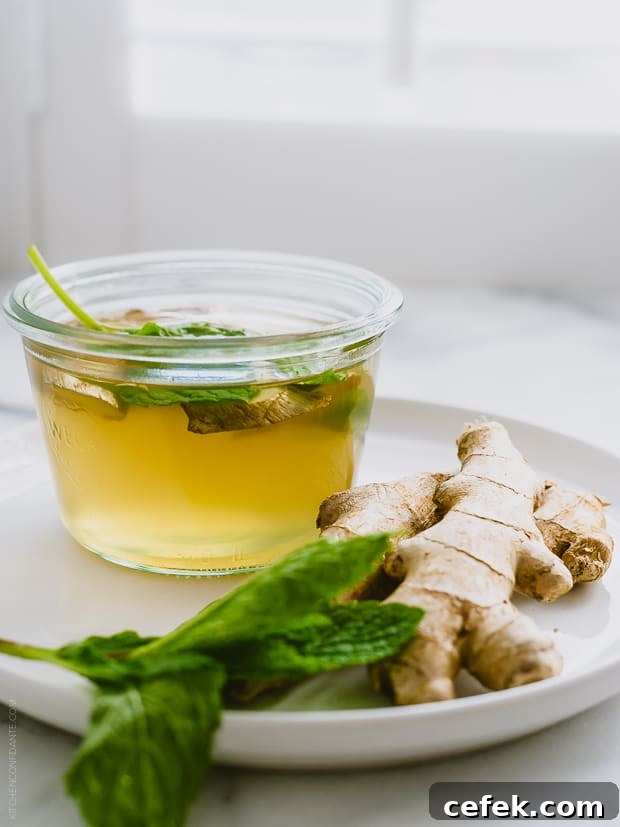 A coconut water cooler alongside fresh ginger.