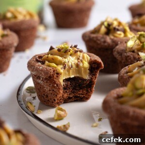 Chocolate cookie cups filled with pistachio cream cheese frosting
