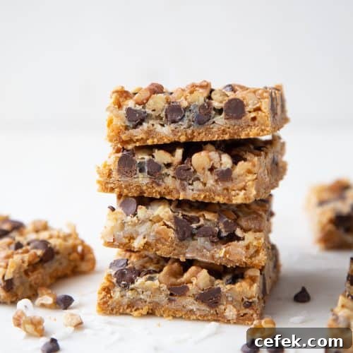 7 layer bars stacked up on a white marble tray.