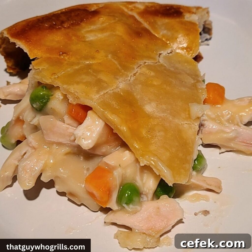 Smoked Turkey Pot pie slice on a white plate