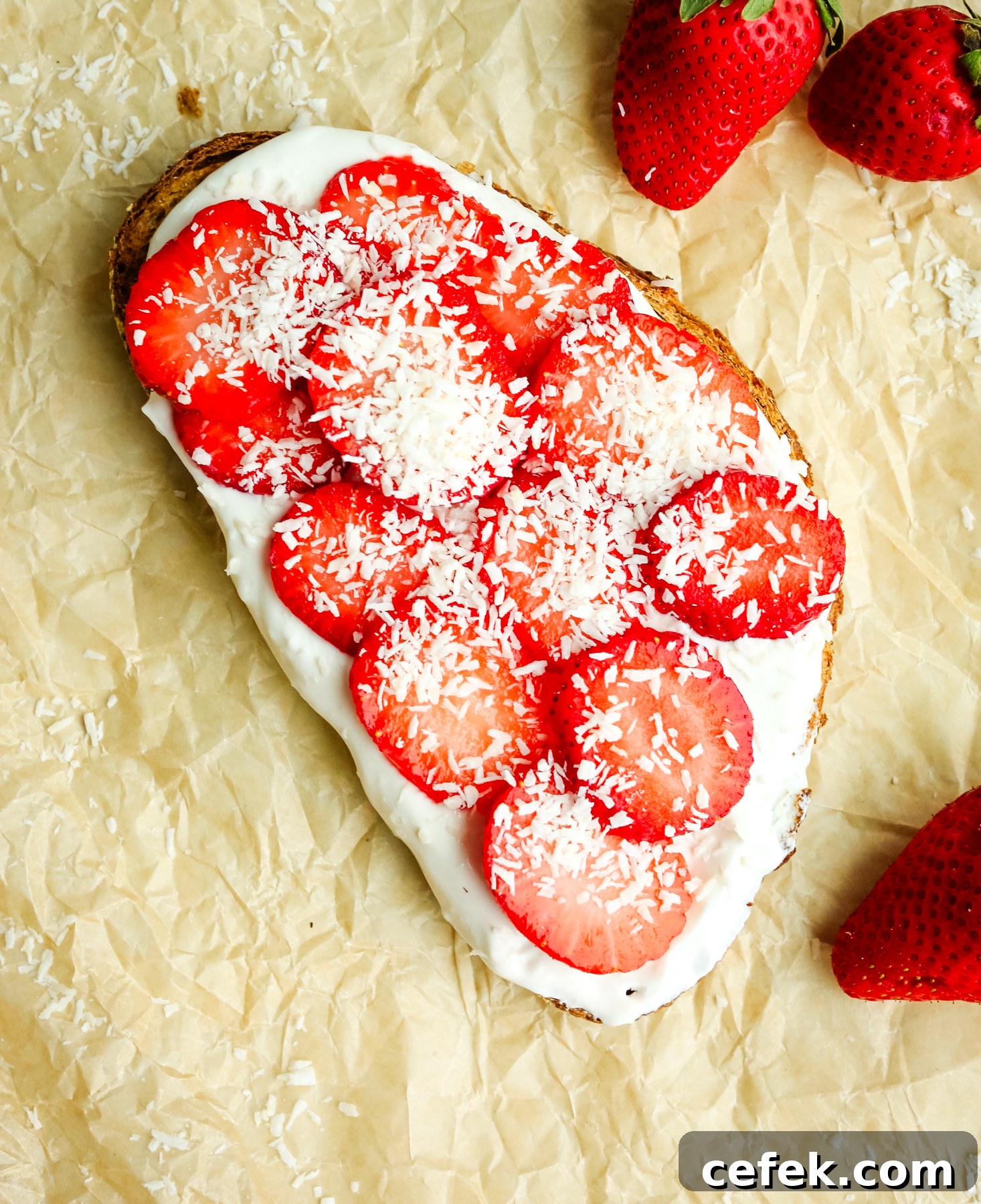 Toast with fresh strawberries and shredded coconut toppings