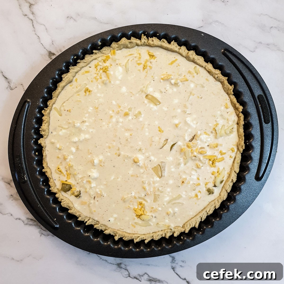 Onions and grated cheese in a pie crust, covered with a cream and egg mixture.