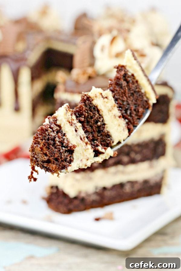 a fork holding a bite of chocolate cake with peanut butter buttercream.