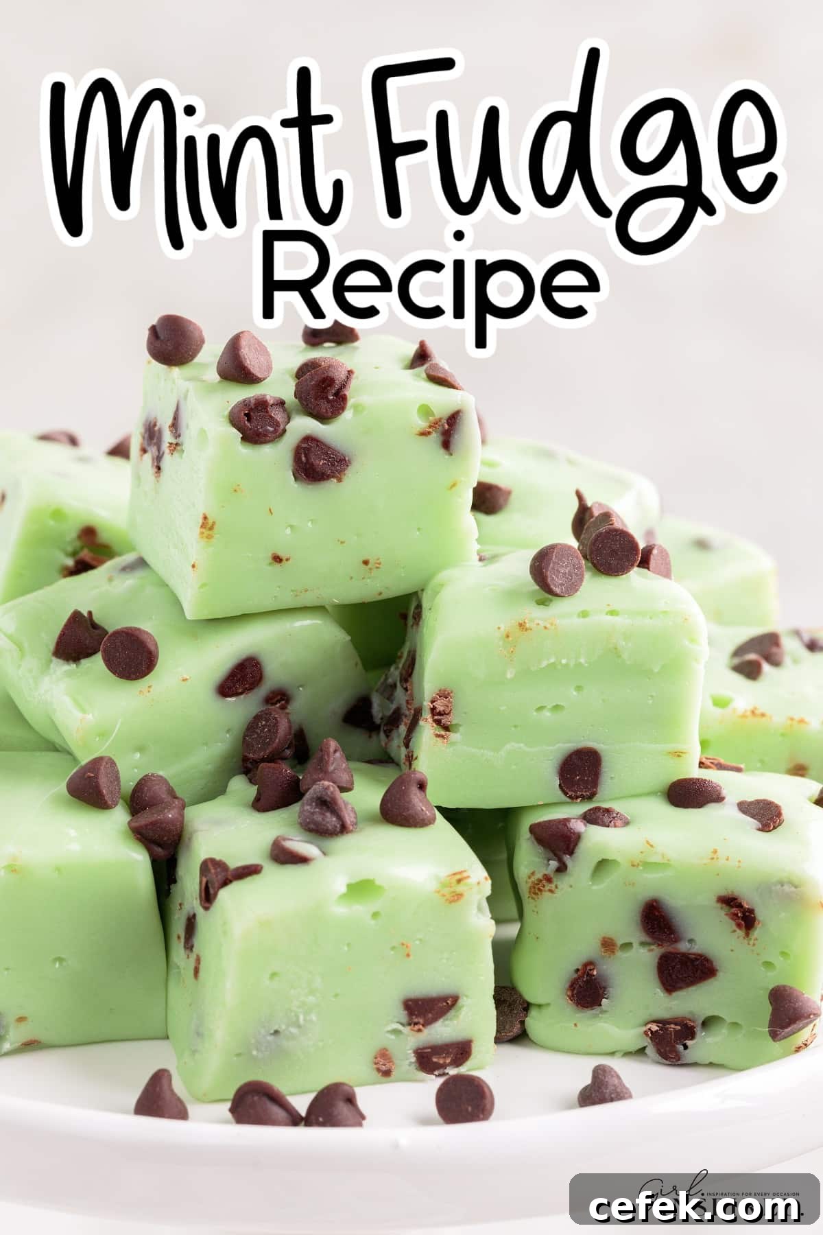 Squares of mint fudge stacked on top of serving stand with text title overlay.