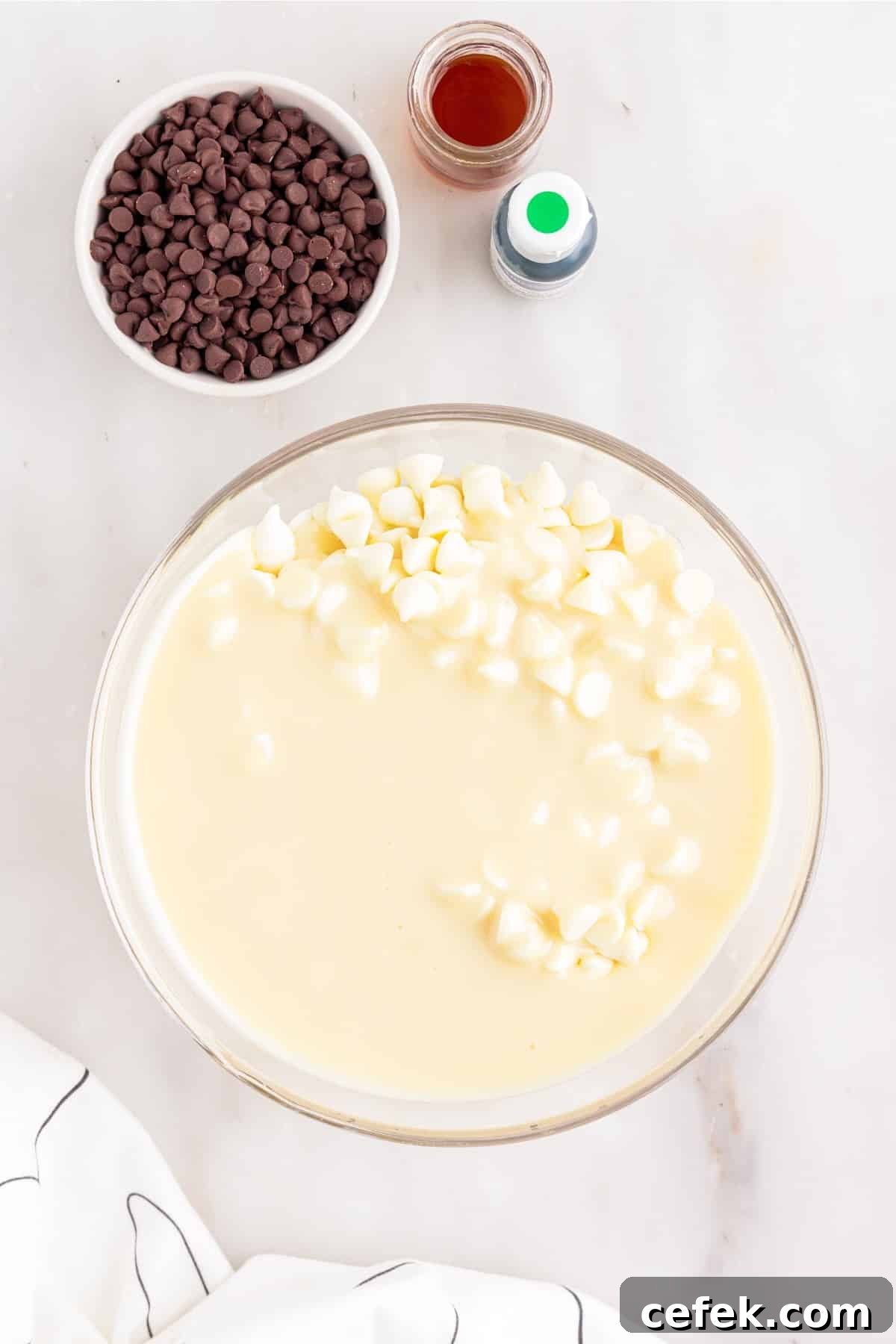 Mixing the white chocolate chips with the condensed milk.
