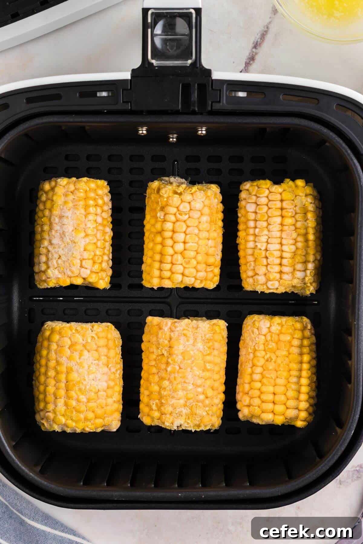 Frozen corn on the cob in the basket. 