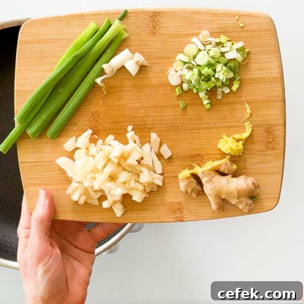 Prepping the vegetables on a cutting board.