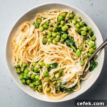 Pasta with Peas, parmesan and lemon in a bowl.
