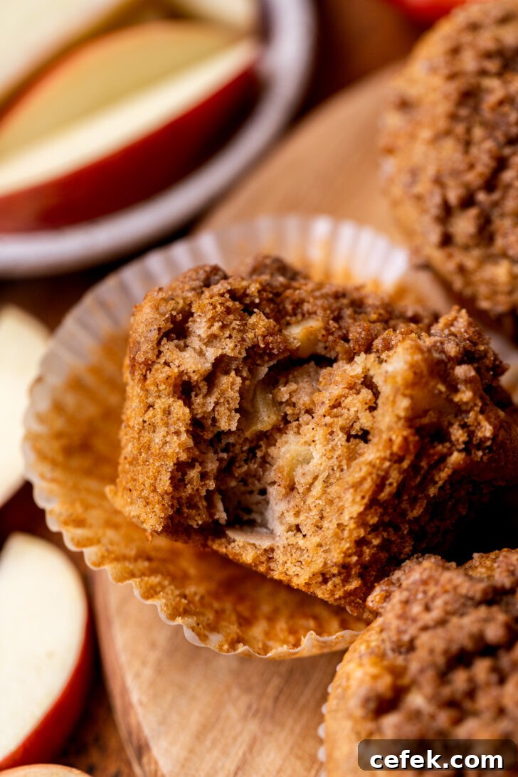 Bite missing from apple muffins.