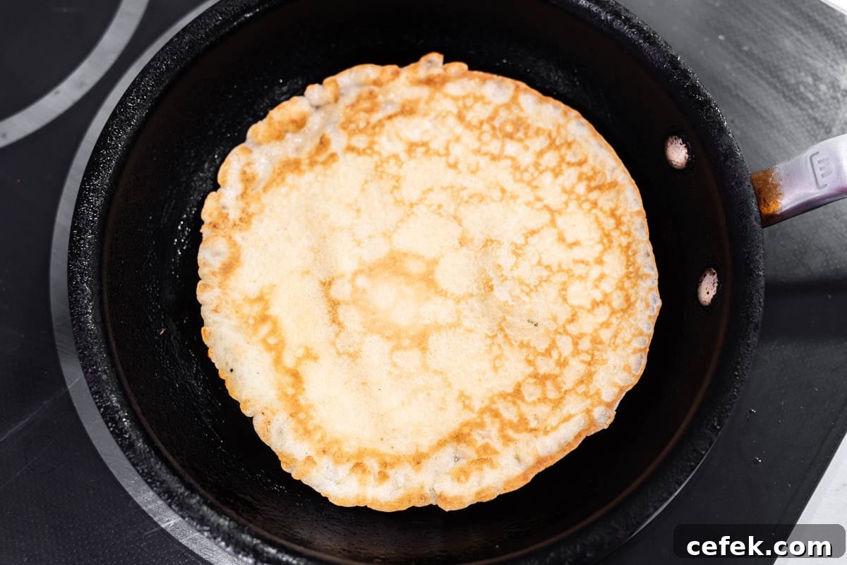 Crepe cooked in skillet.