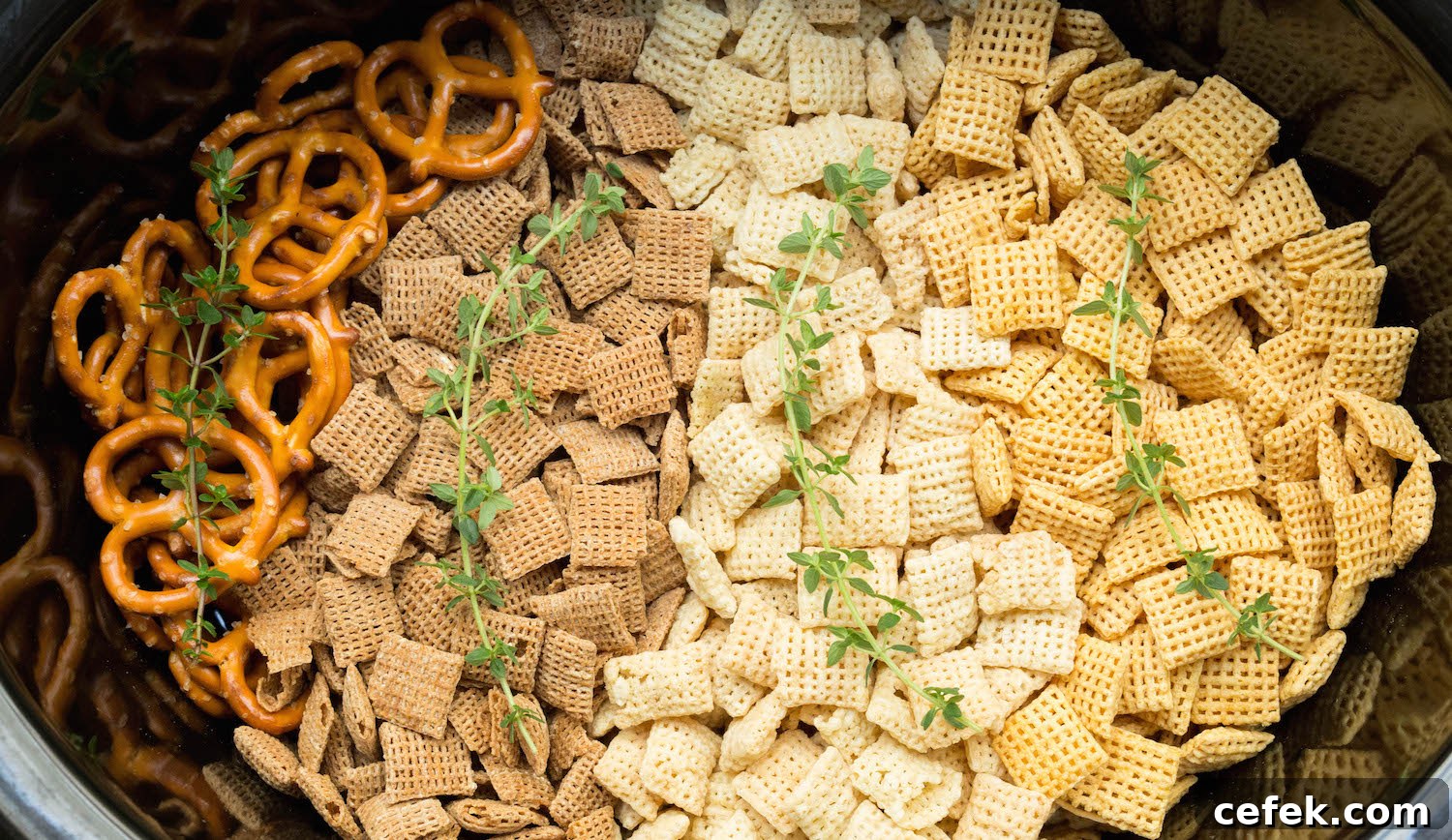 Crock Pot Chex Mix made with duck fat, sriracha peanuts, and candied bacon.