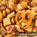 A classic snack with a modern, decadent twist. Duck Fat Chex Mix made in the crock pot.