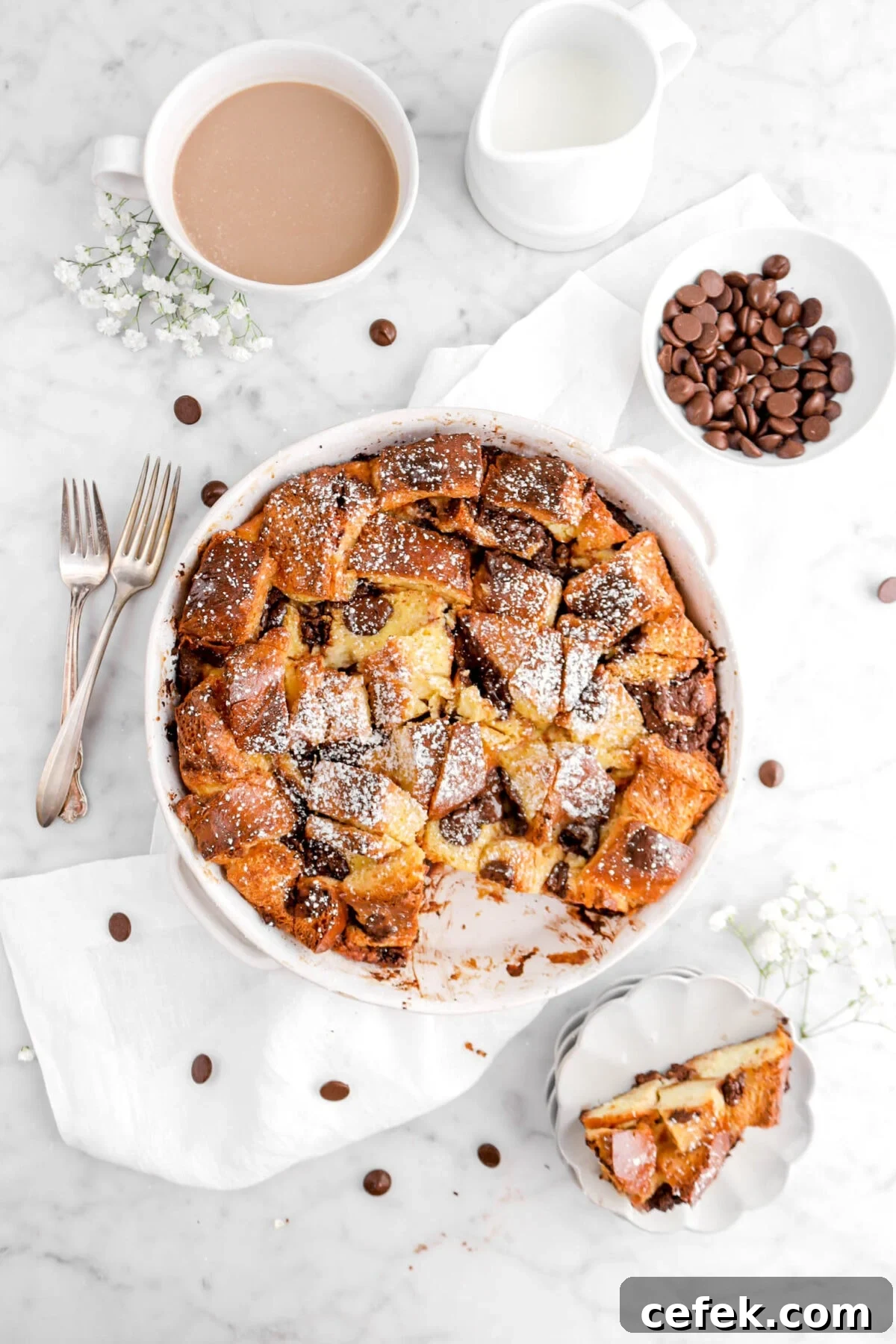 overhead shot of bread pudding with slice missing on scalloped plates beside.