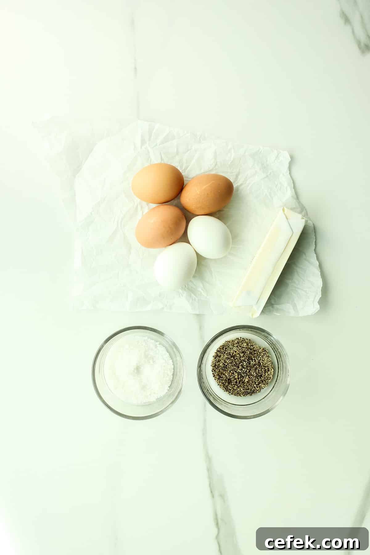 five eggs, butter, salt, and pepper.