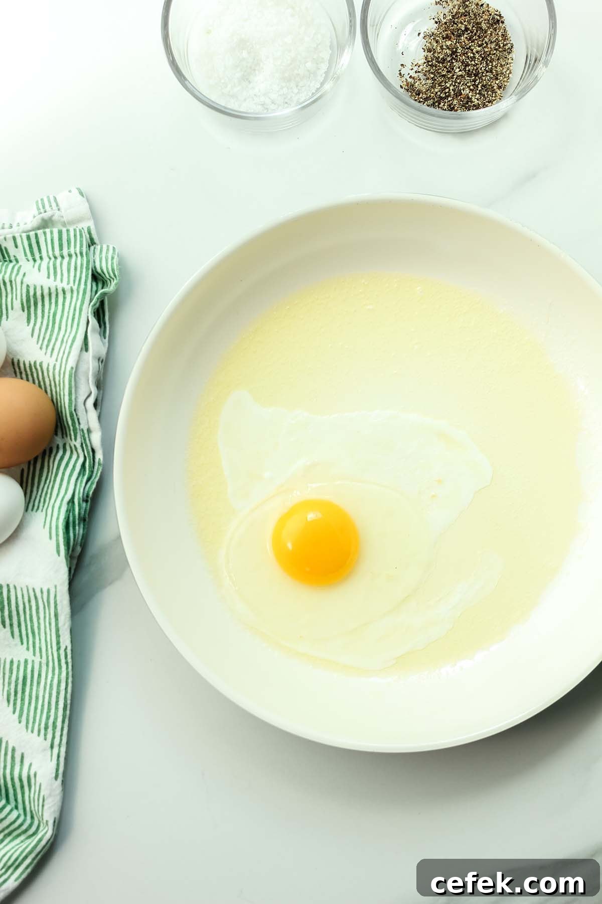 egg cooking in a skillet.