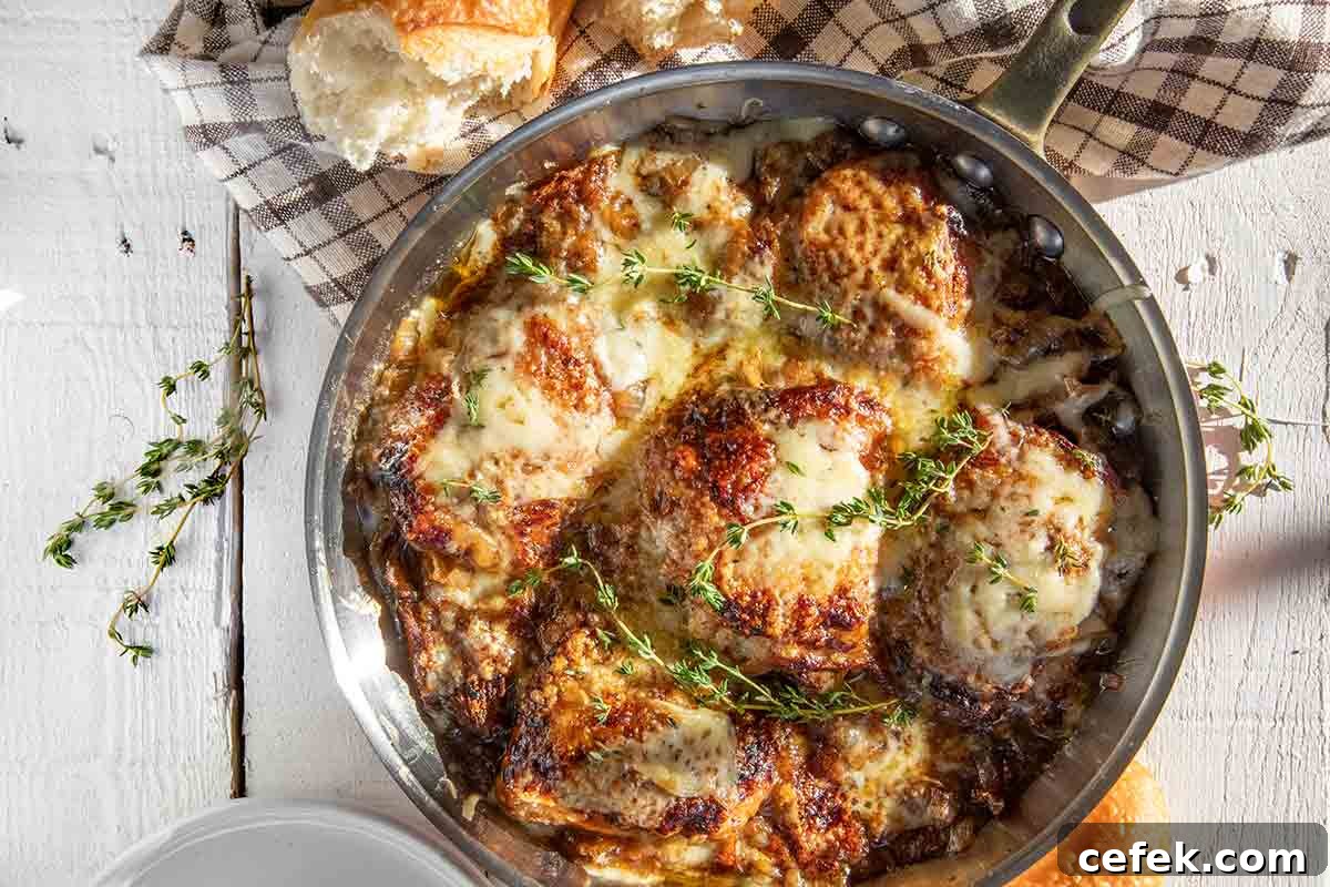 French onion skillet chicken in a copper frying pan