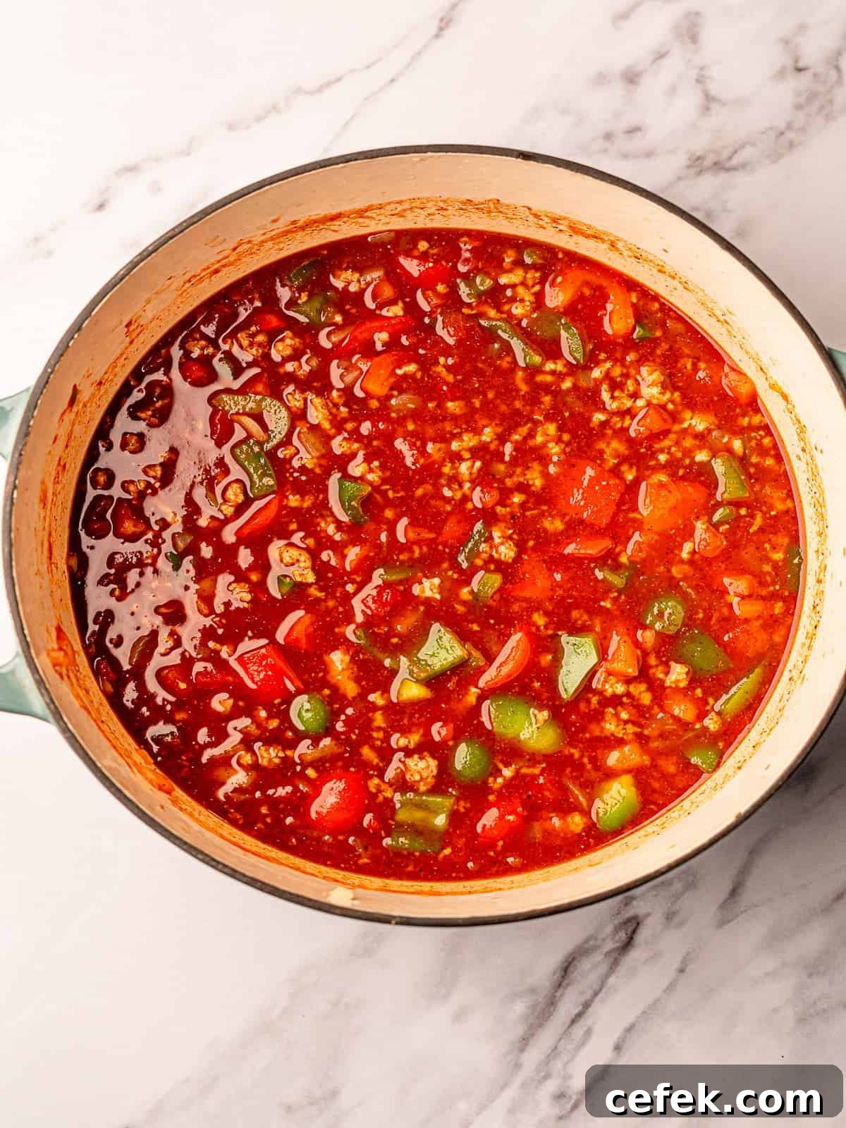 Chili in a large pot before cooking.