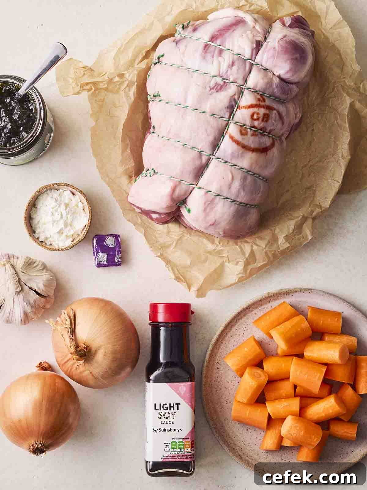 The raw ingredients for cooking Slow Cooker Leg of Lamb recipe laid out on a counter top.
