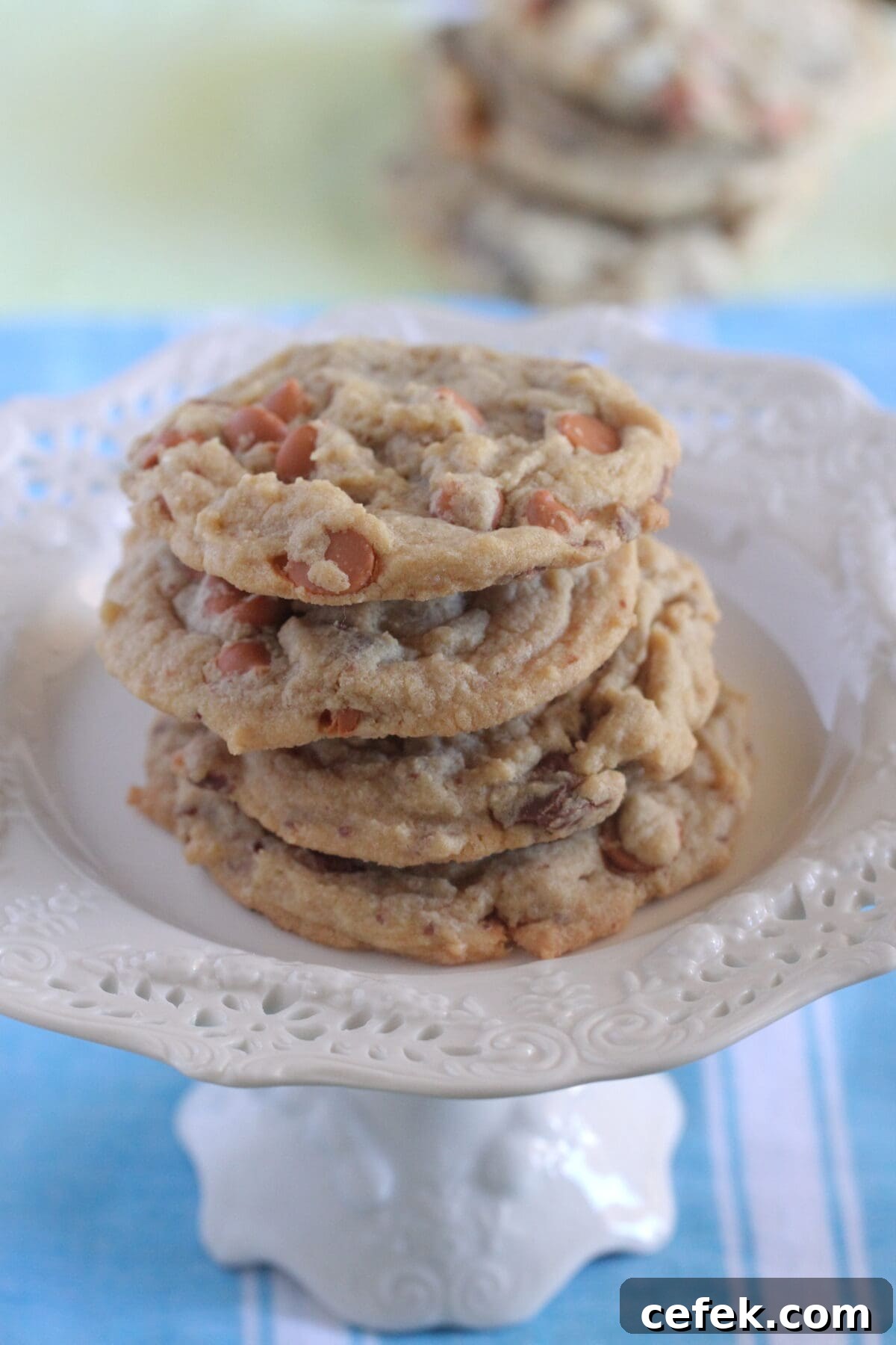 butterscotch chocolate chip cookies stacked on cake stand