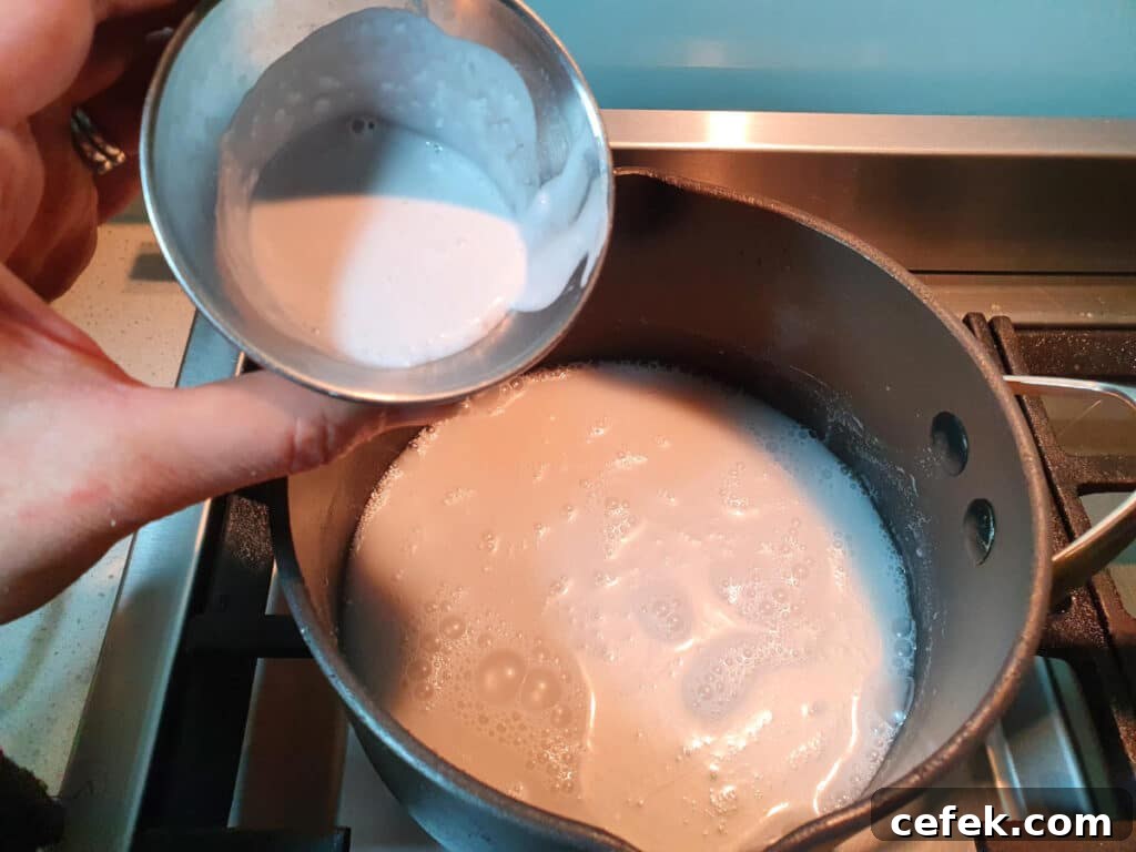 adding tapioca slurry to coconut milk mix.