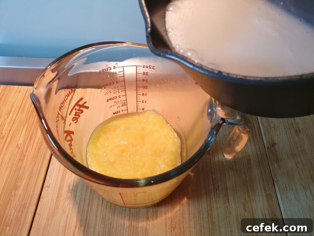 adding coconut milk mix to reduced pineapple.