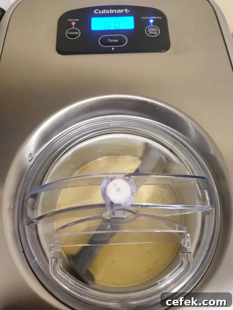 churning ice cream in ice cream machine.
