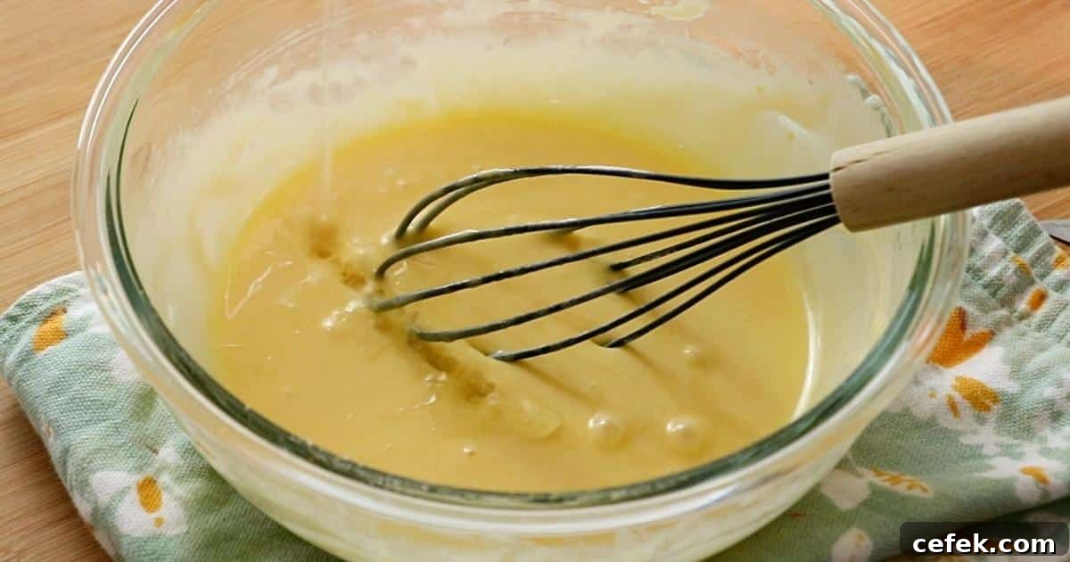 adding lemon juice to the batter to make lemon madeleines