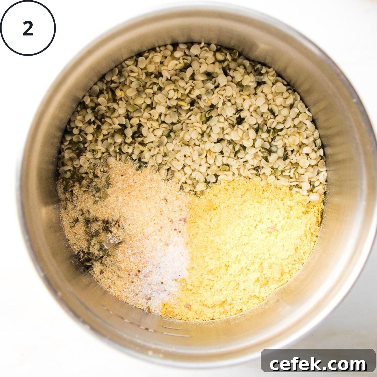 Hemp seeds, nutritional yeast, salt, garlic powder and oregano in a spice grinder.