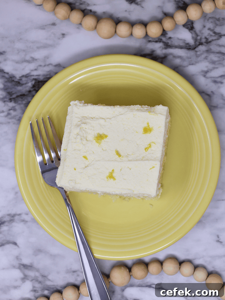 Lemon Poke Cake with mascarpone cheese topping