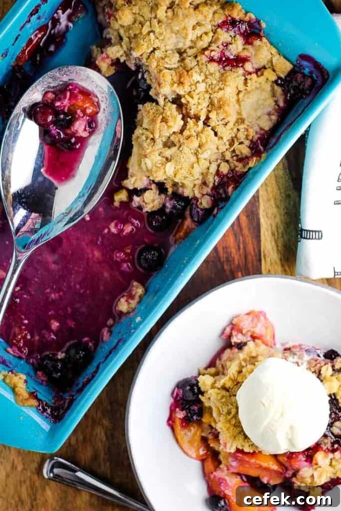overhead view of blueberry peach crisp in a baking dish