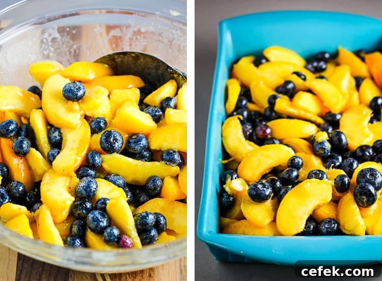 Sliced peaches and blueberries in a bowl and poured into a baking dish