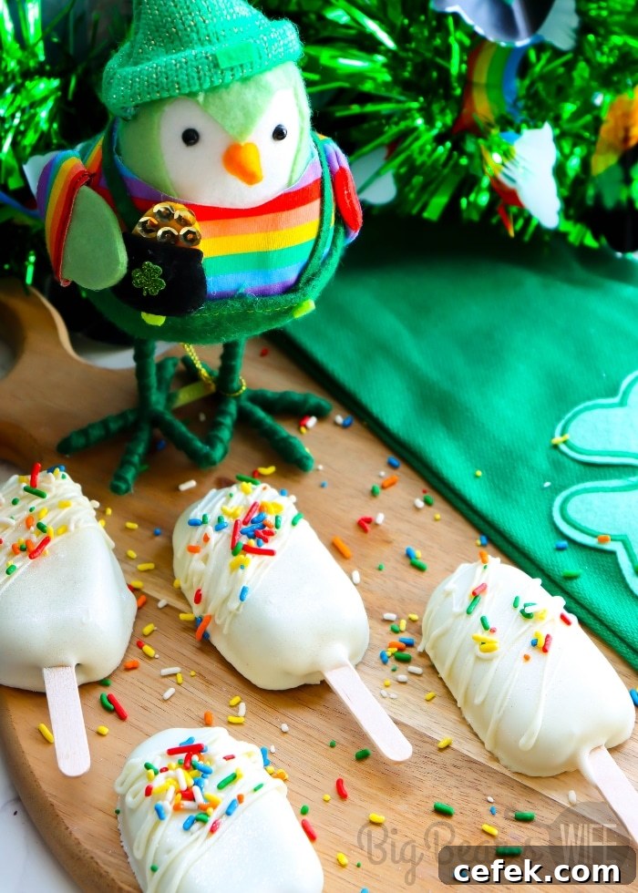St. Patrick’s Day cake pops with rainbow sprinkles and white chocolate coating