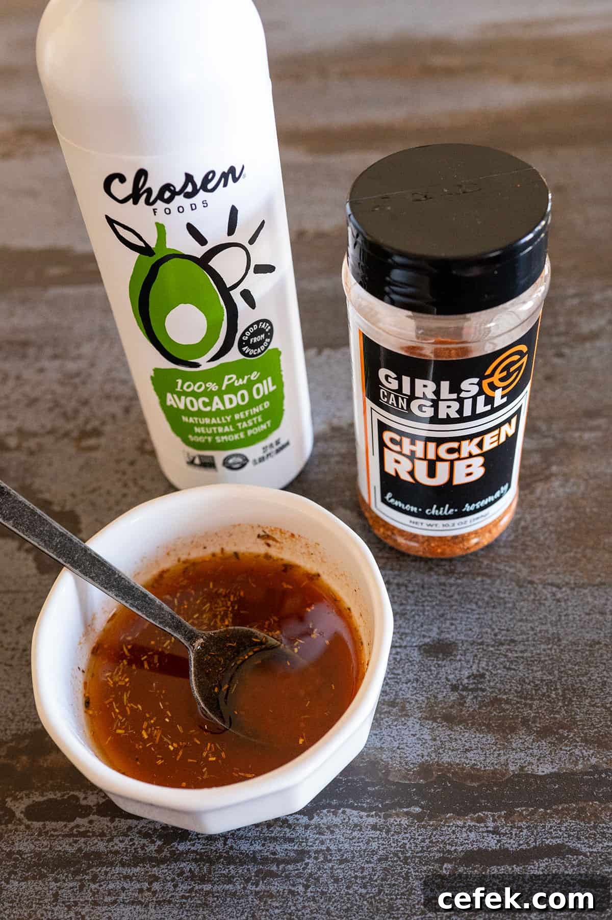 Bowl of butter, oil and chicken rub.