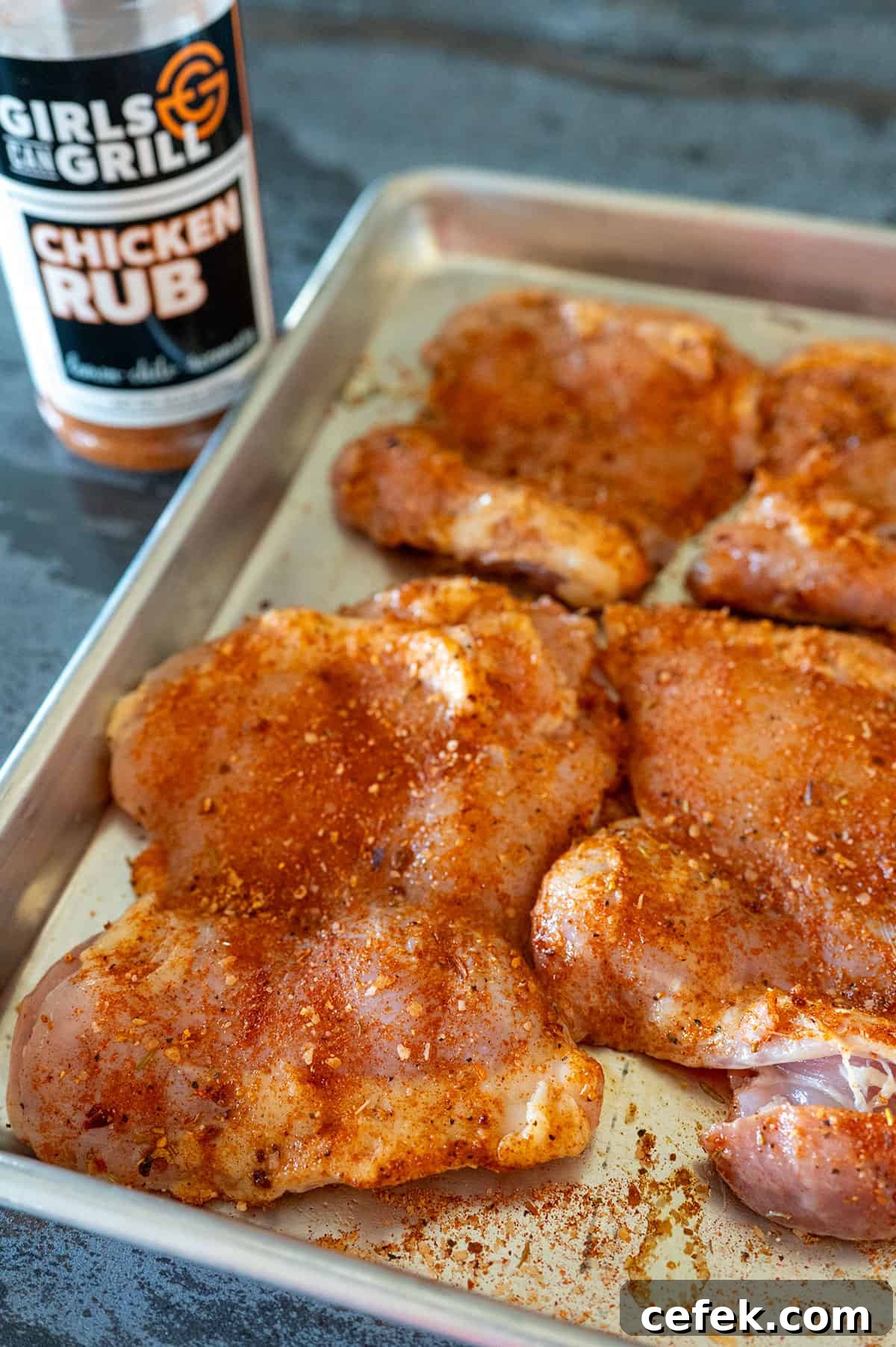 chicken thighs seasoned with Girls Can Grill Chicken Rub.