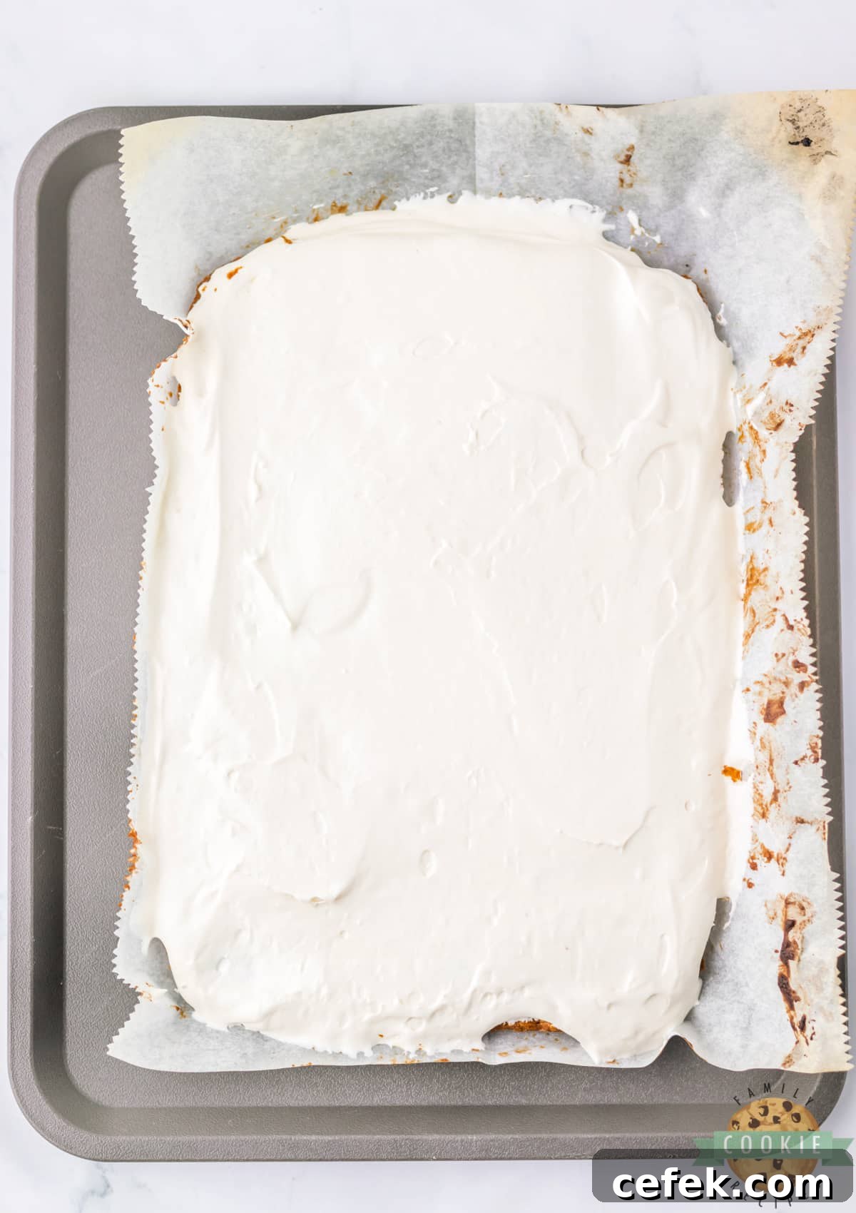 Spread the marshmallow filling over the cookie layer.