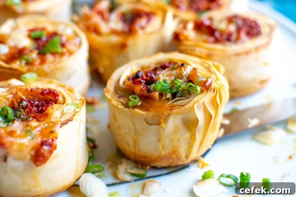 A close up of a choriqueso pinwheel appetizer