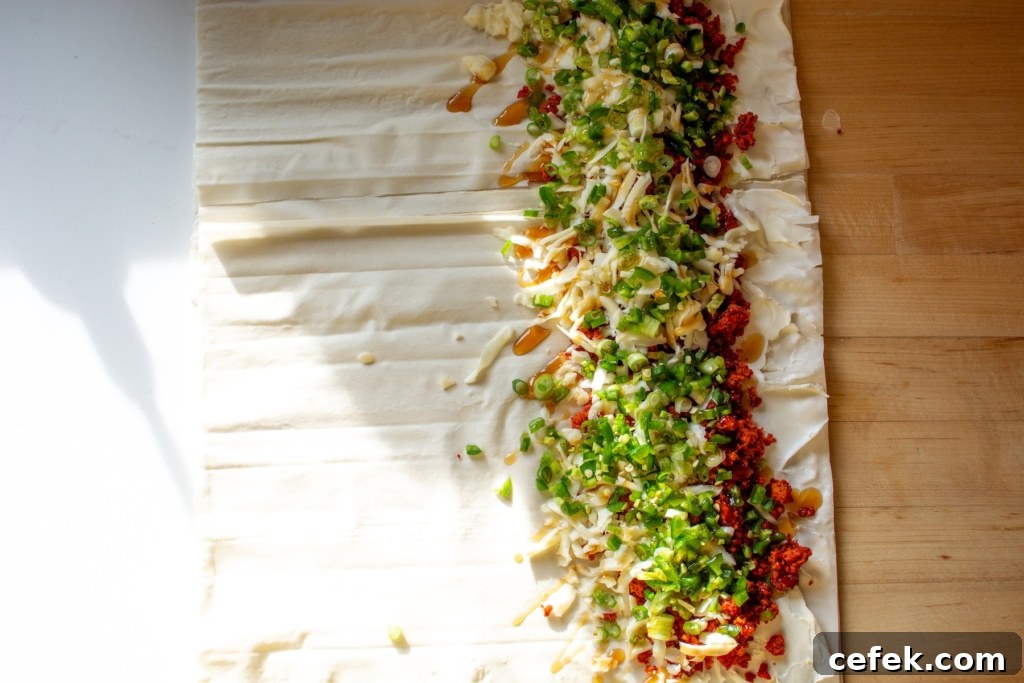 The filling on the rolled out piece of phyllo dough