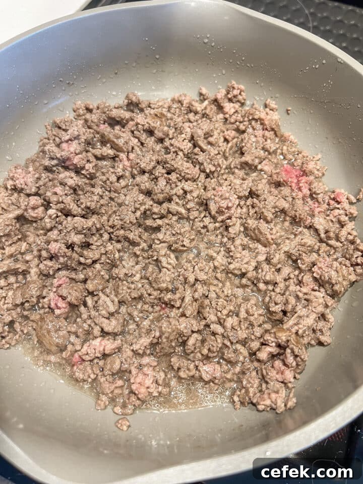 Browned ground beef in a large non-stick skillet